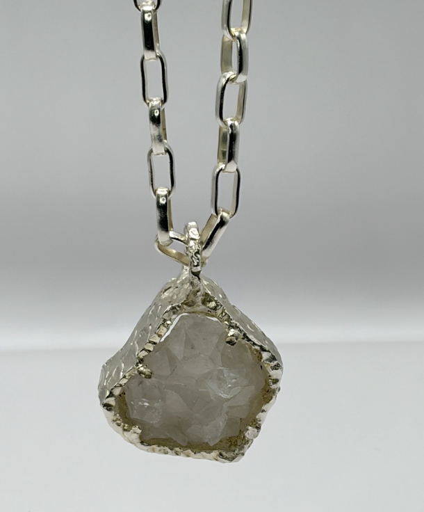 Silver pendant necklace with a quartz stone, product shot